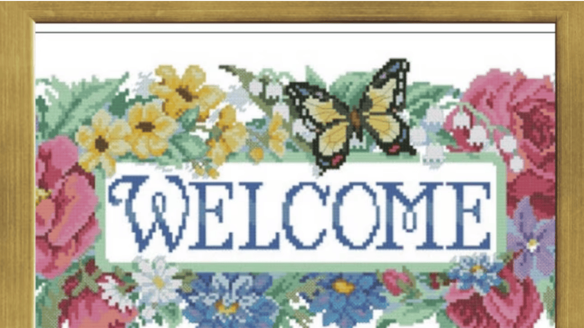 welcome sign with butterfly and flowers