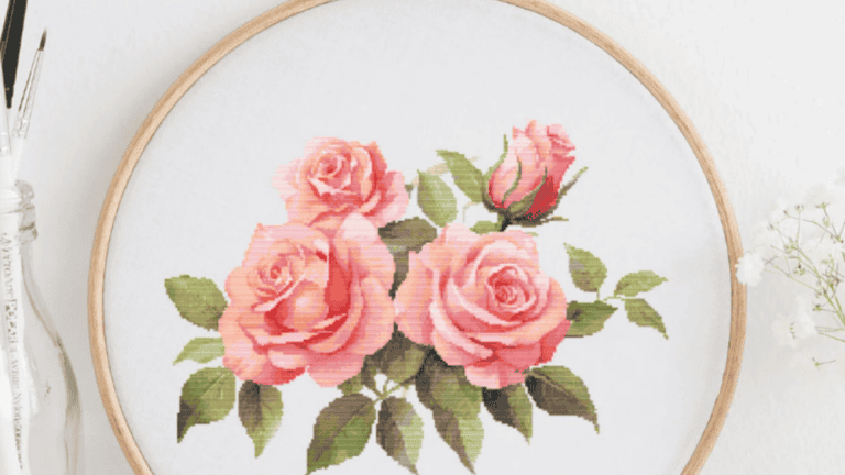 4 pink roses in this cross stitch pattern