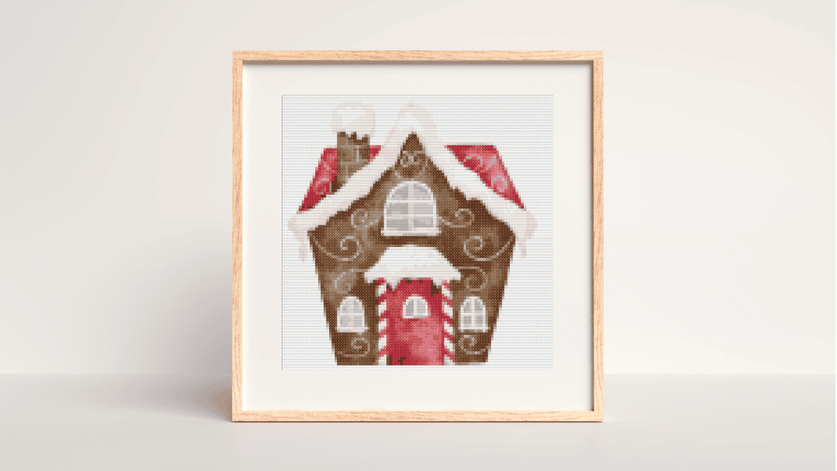 Cross stitch gingerbread patterns with a red gingerbread house and brown