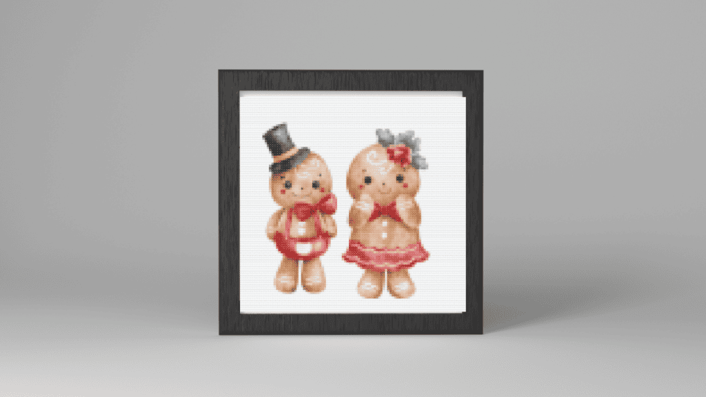 cross stitch gingerbread patterns of A gingerbread couple with him having a black top hat and her having red flowers