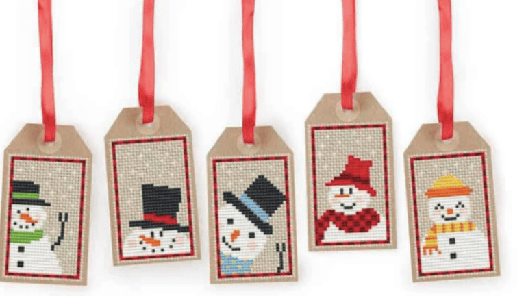 cross stitch snowmen patterns turned into gift tags