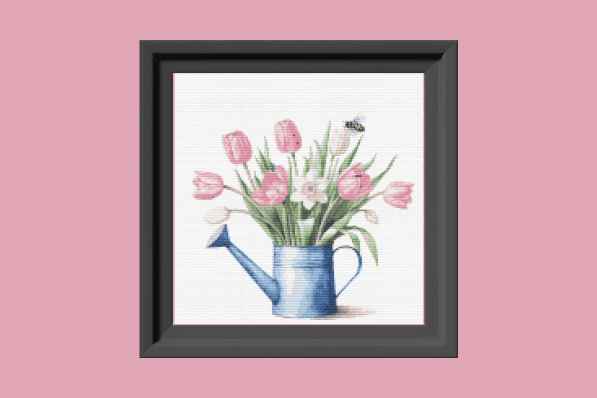 Pink tulips and watering can