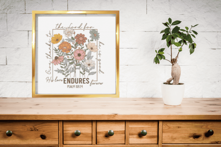 Bible cross stitch pattern that says his love endures forever with Florals