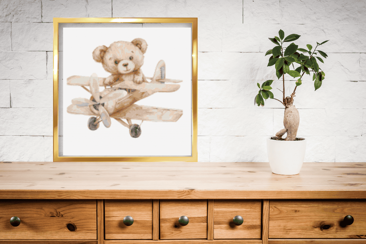 Teddy bear flying a brown plain